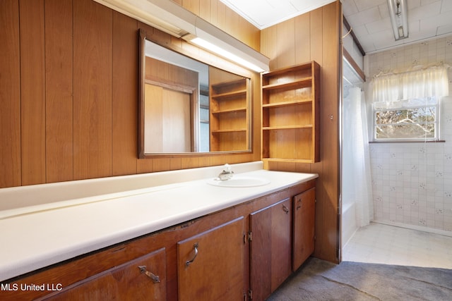 bathroom with wooden walls and vanity