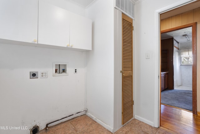 washroom featuring ornamental molding, light hardwood / wood-style flooring, washer hookup, and hookup for an electric dryer