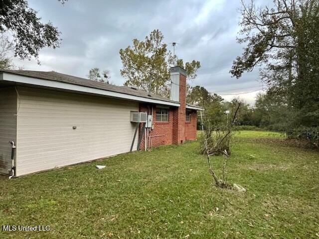 view of property exterior with a yard