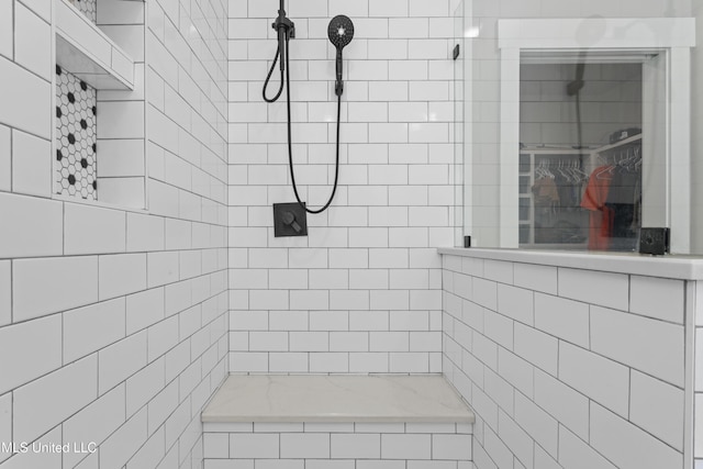 full bathroom with tiled shower