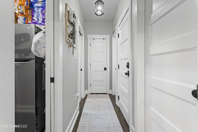 corridor featuring dark wood-style floors