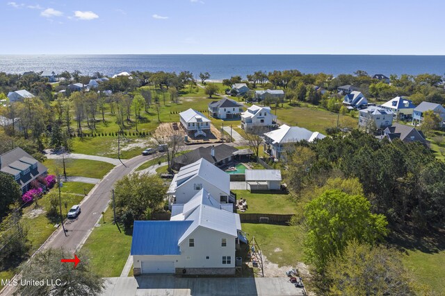 aerial view featuring a residential view and a water view