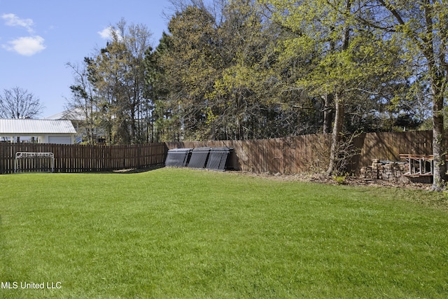 view of yard featuring a fenced backyard