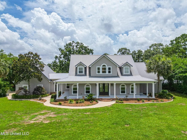 5029 Crescent Ridge Dr, Kiln, MS 39556 - view of front of property featuring covered porch, a metal roof, and a front lawn