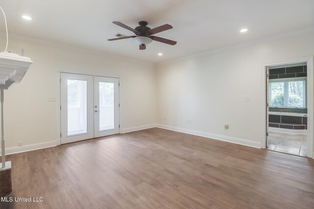 5029 Crescent Ridge Dr, Kiln, MS 39556 - spare room with ceiling fan, french doors, crown molding, wood finished floors, and recessed lighting