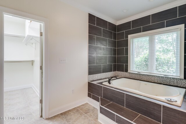 5029 Crescent Ridge Dr, Kiln, MS 39556 - full bath with a jetted tub, tile patterned floors, a spacious closet, and crown molding