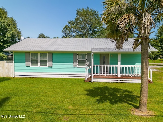 ranch-style home with covered porch and a front lawn