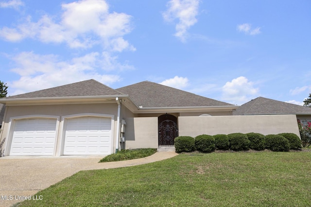 215 Azalea Ct, Brandon, MS 39047 - single story home featuring an attached garage, stucco siding, a front lawn, concrete driveway, and roof with shingles