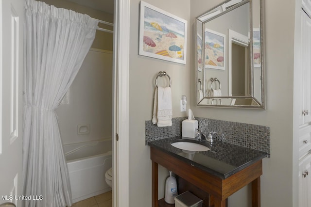 215 Azalea Ct, Brandon, MS 39047 - bathroom with shower / tub combo with curtain, tile patterned floors, vanity, toilet, and decorative backsplash