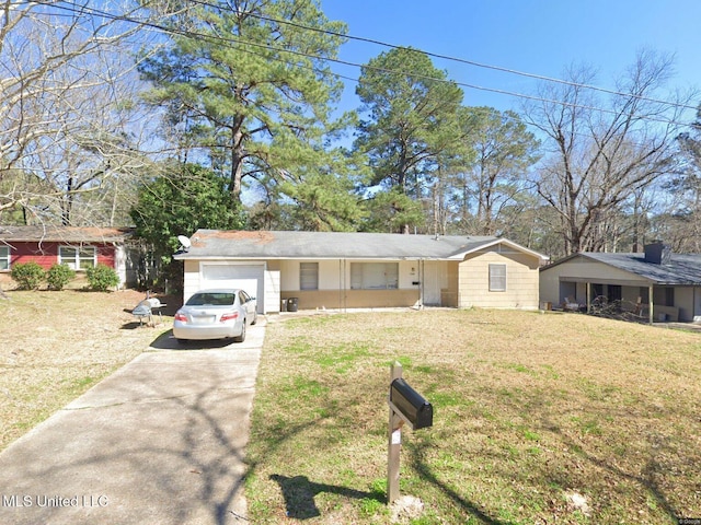 ranch-style house with concrete driveway, an attached garage, and a front lawn