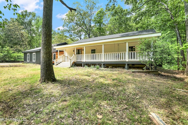 single story home with covered porch and a front lawn