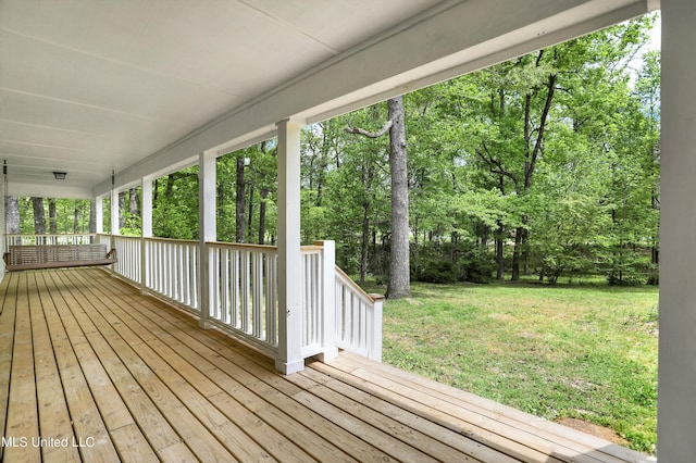 deck featuring a lawn