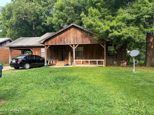 602 S Bayou Ave, Cleveland, MS 38732 - view of front of property featuring a carport and a front lawn