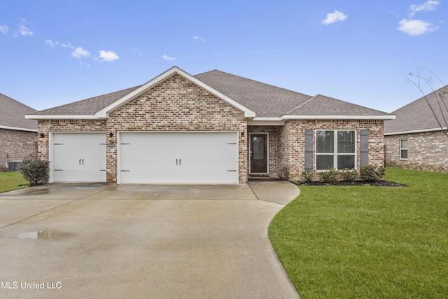 single story home featuring brick siding, a shingled roof, a garage, driveway, and a front lawn