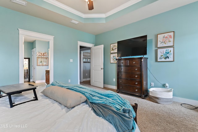 18225 Tulip Cv, Gulfport, MS 39503 - bedroom with crown molding, baseboards, carpet floors, a tray ceiling, and ensuite bath