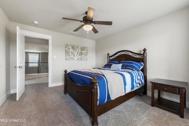 18225 Tulip Cv, Gulfport, MS 39503 - bedroom with carpet, a ceiling fan, and baseboards