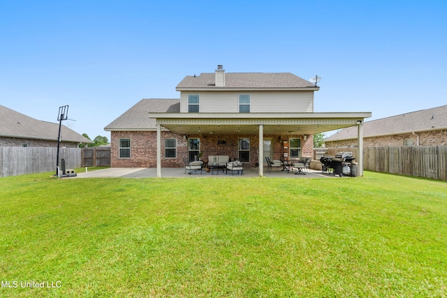 18225 Tulip Cv, Gulfport, MS 39503 - rear view of property featuring brick siding, a patio area, a chimney, and a shingled roof
