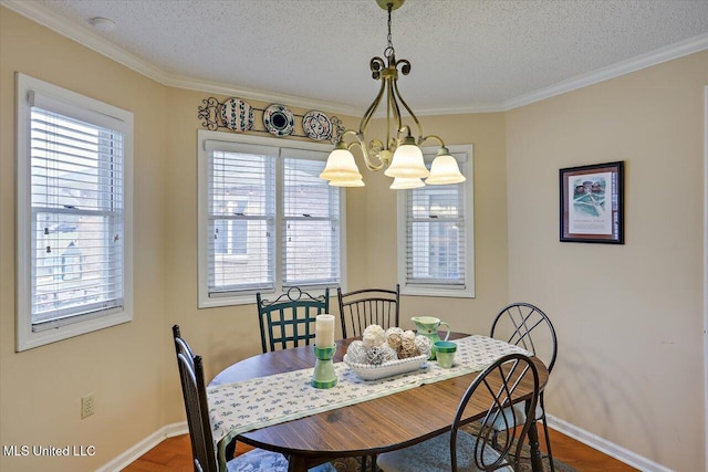 dining room with hardwood / wood-style flooring, ornamental molding, and a textured ceiling