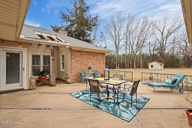 view of patio featuring a storage unit