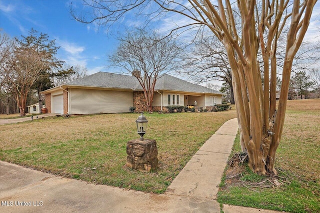 ranch-style home featuring a garage and a front yard