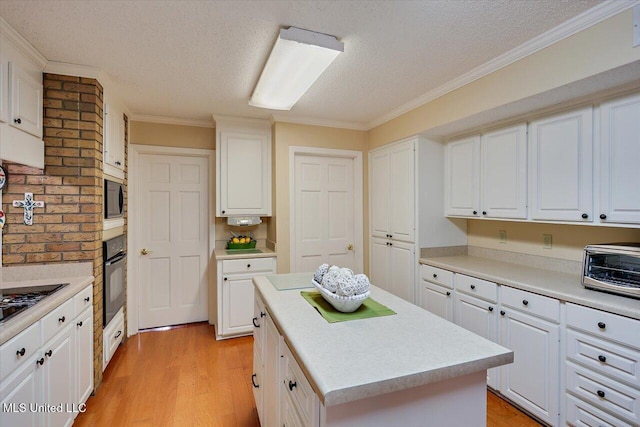 kitchen with a kitchen island and white cabinets