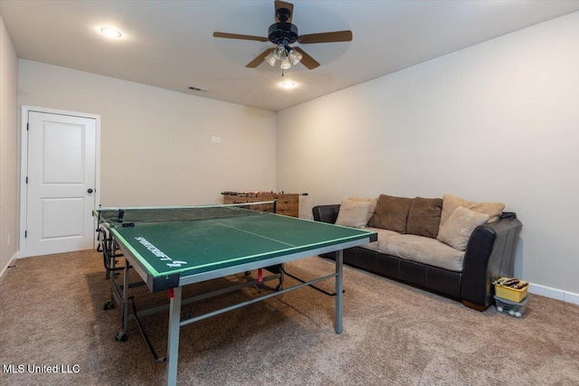 game room with a ceiling fan, baseboards, visible vents, and carpet