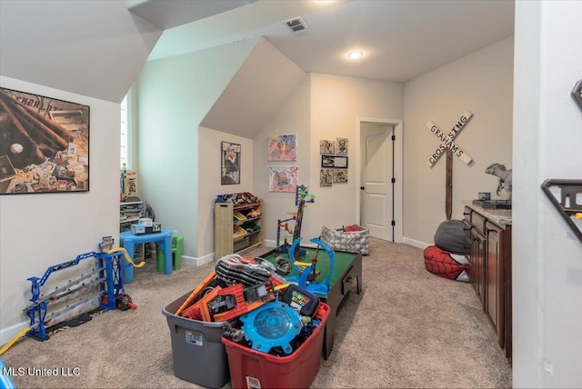 playroom featuring visible vents, baseboards, carpet floors, and vaulted ceiling