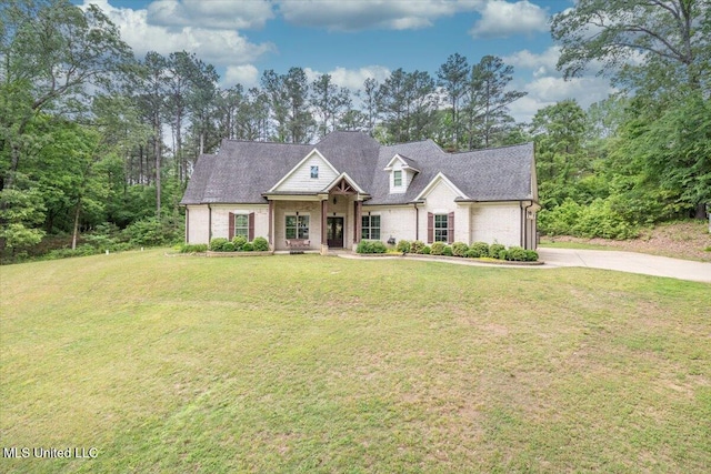 craftsman-style house featuring concrete driveway, brick siding, and a front yard
