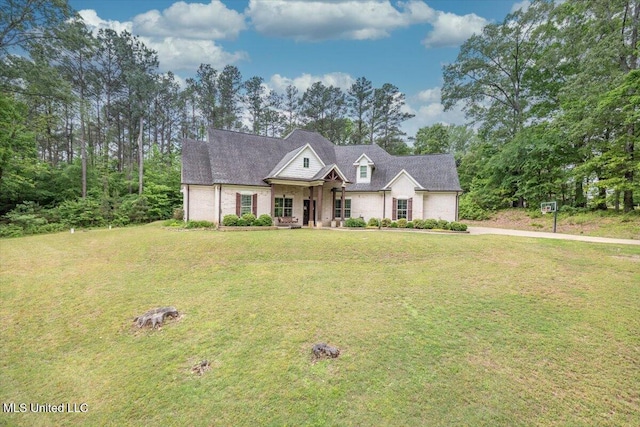 view of front of property featuring concrete driveway, an attached garage, and a front lawn