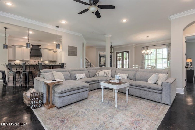 living area with crown molding, baseboards, ceiling fan with notable chandelier, and recessed lighting