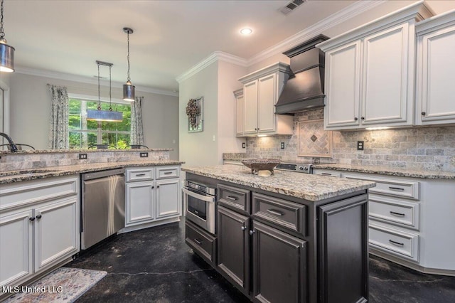 kitchen with backsplash, stainless steel appliances, visible vents, and custom exhaust hood