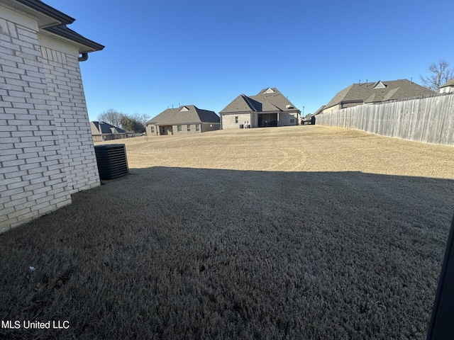 view of yard featuring central AC unit