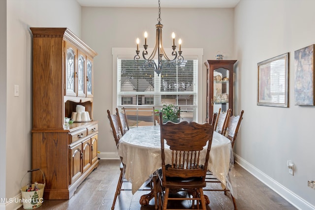 dining room featuring light hardwood / wood-style flooring, a notable chandelier, and a wealth of natural light