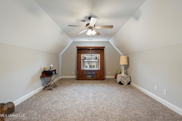 bonus room featuring lofted ceiling, carpet flooring, and ceiling fan