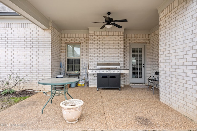 view of patio / terrace with area for grilling and ceiling fan