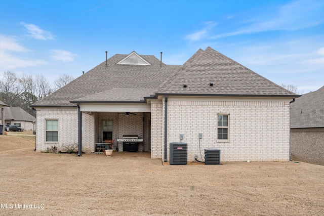 rear view of property with a patio area and central AC unit