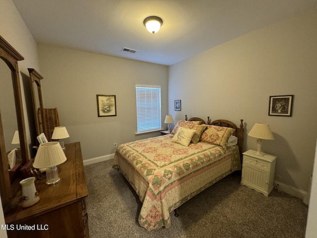 bedroom featuring dark colored carpet