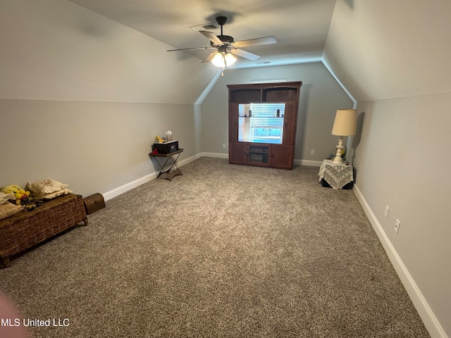 additional living space with ceiling fan, carpet flooring, and lofted ceiling