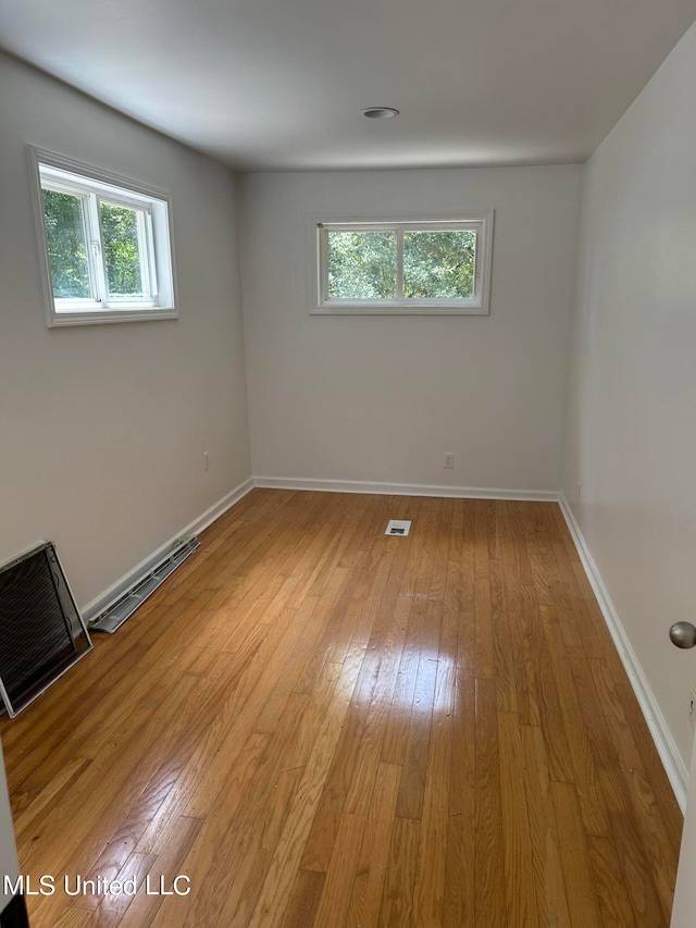 unfurnished room with light hardwood / wood-style flooring