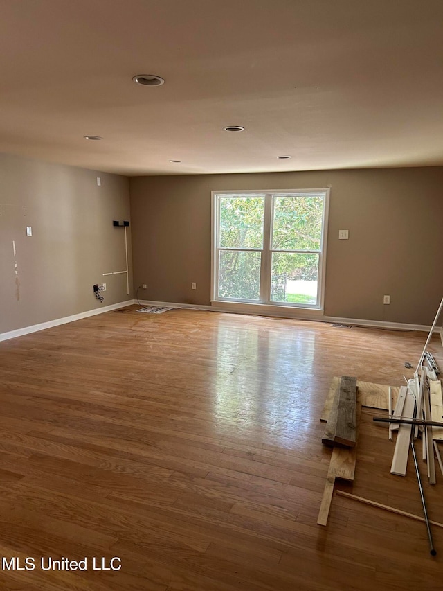 empty room with wood-type flooring