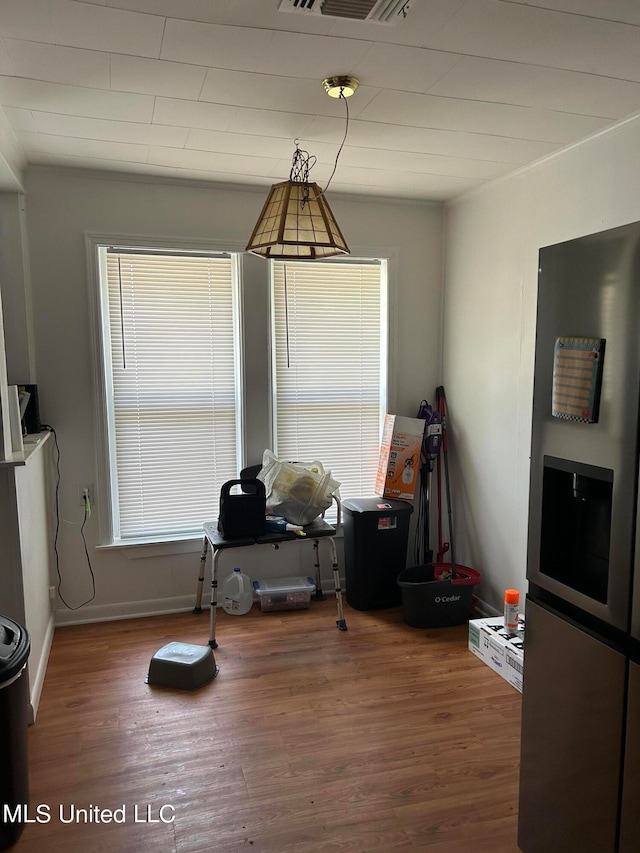 dining space featuring a wealth of natural light and hardwood / wood-style floors