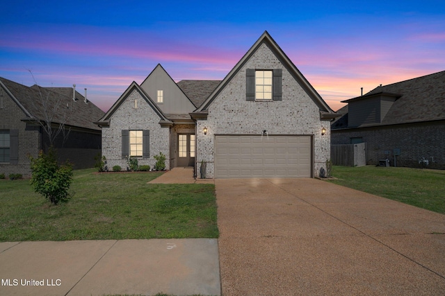 7785 Parkridge Dr, Southaven, MS 38671 - french provincial home featuring a front yard, brick siding, an attached garage, and driveway