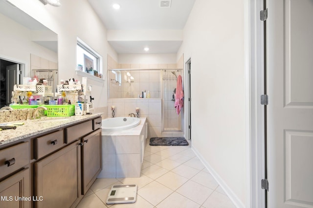 7785 Parkridge Dr, Southaven, MS 38671 - bathroom with a stall shower, tile patterned floors, vanity, and a bath