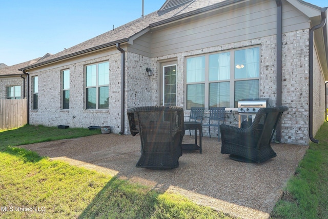 7785 Parkridge Dr, Southaven, MS 38671 - back of house with a patio and brick siding