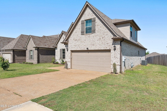 7785 Parkridge Dr, Southaven, MS 38671 - view of front of house featuring brick siding, central AC, a garage, and driveway