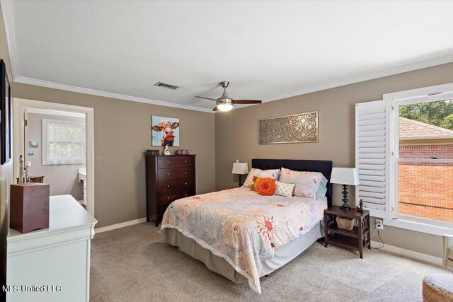 bedroom with ceiling fan, light carpet, and crown molding