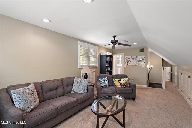 living room with lofted ceiling, carpet floors, and ceiling fan