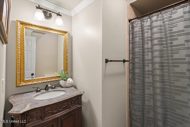 bathroom with vanity, crown molding, and curtained shower