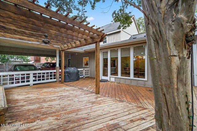 deck with a pergola, ceiling fan, and a grill