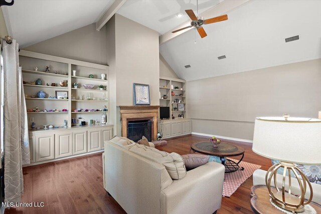 living room with dark hardwood / wood-style floors, beamed ceiling, high vaulted ceiling, and ceiling fan